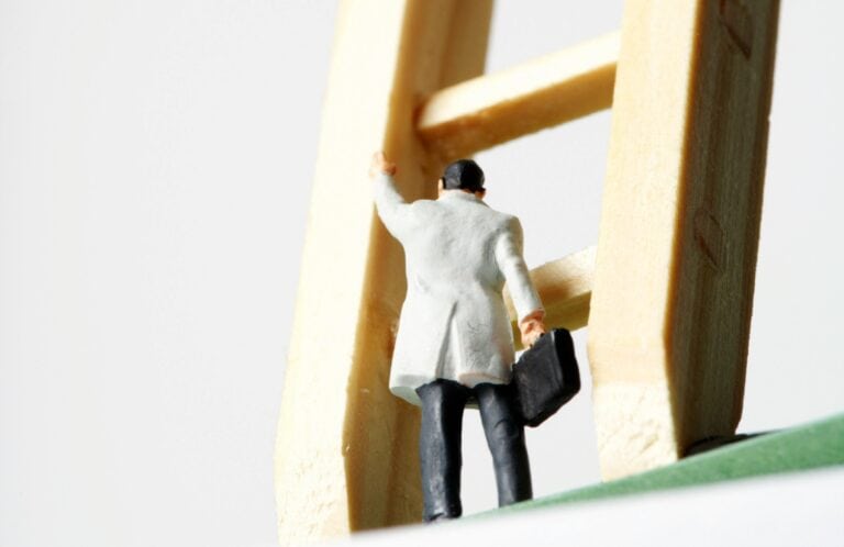 Man climbing a ladder representing getting on the property ladder, UK mortgage advice.